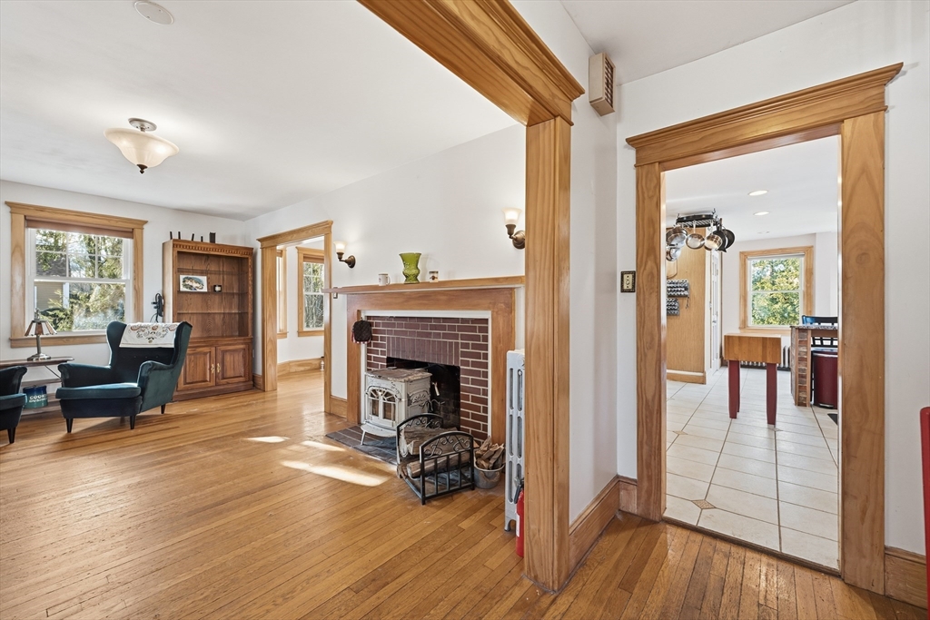 21 High Street Pepperell, MA 01463 - Photo 6 of 40 a view of a livingroom with furniture and a fireplace