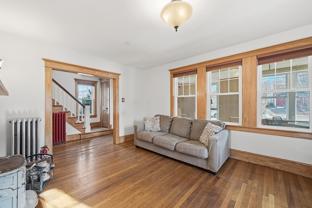 21 High Street Pepperell, MA 01463 - Photo 7 of 40 a living room with furniture and a large window