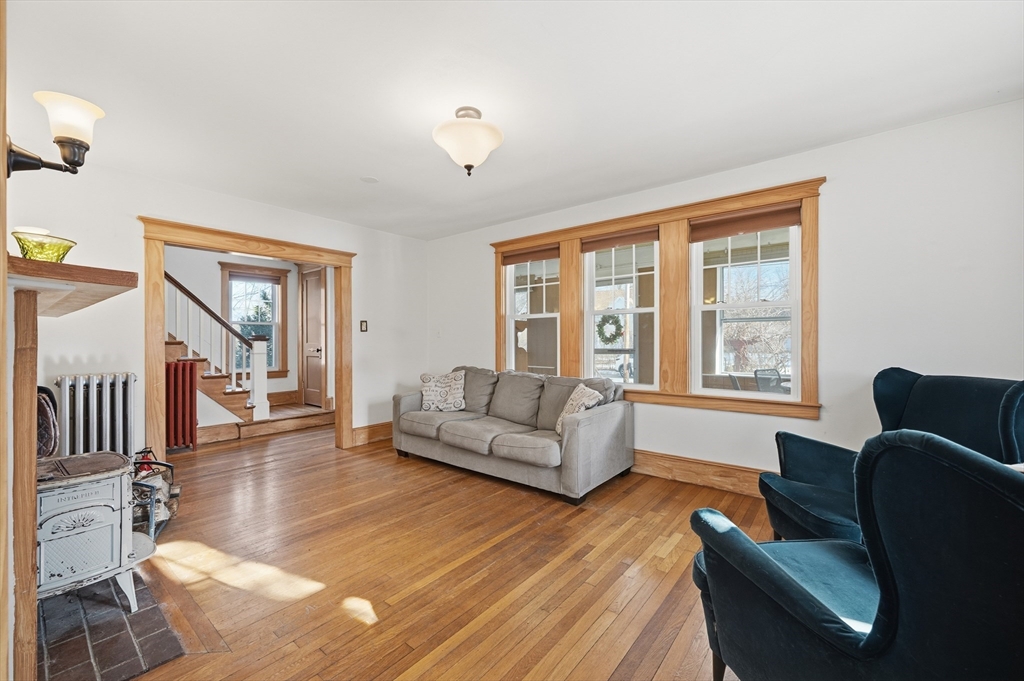 21 High Street Pepperell, MA 01463 - Photo 8 of 40 a living room with furniture and a large window