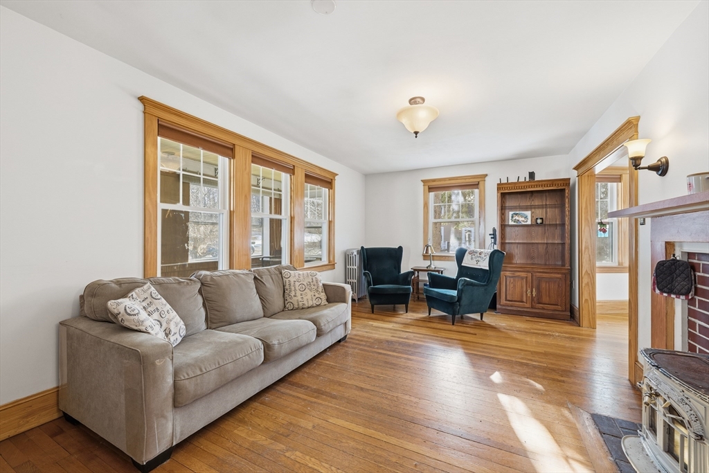 21 High Street Pepperell, MA 01463 - Photo 9 of 40 a living room with furniture and a large window