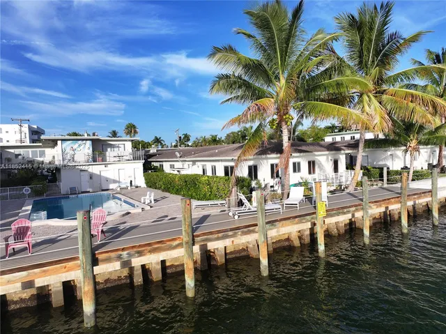 a view of a lake with palm trees