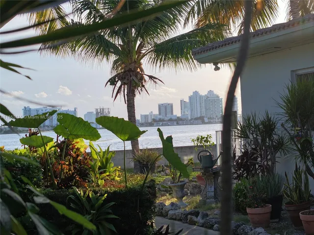 a view of a palm trees in front of a house