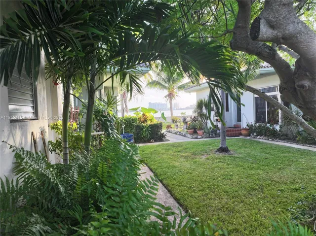 a view of backyard with green space