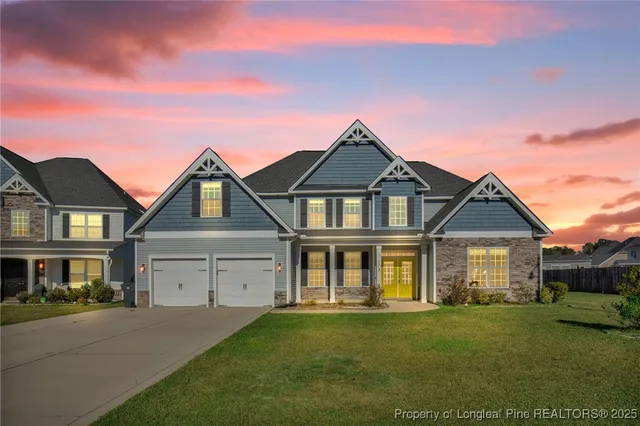 front view of a house with a yard