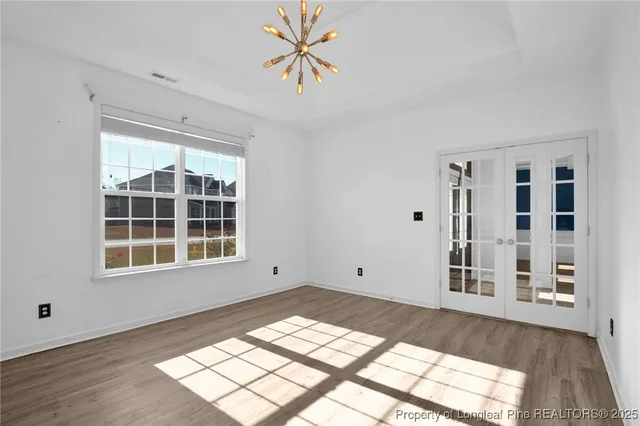 a view of a livingroom with an empty space and window
