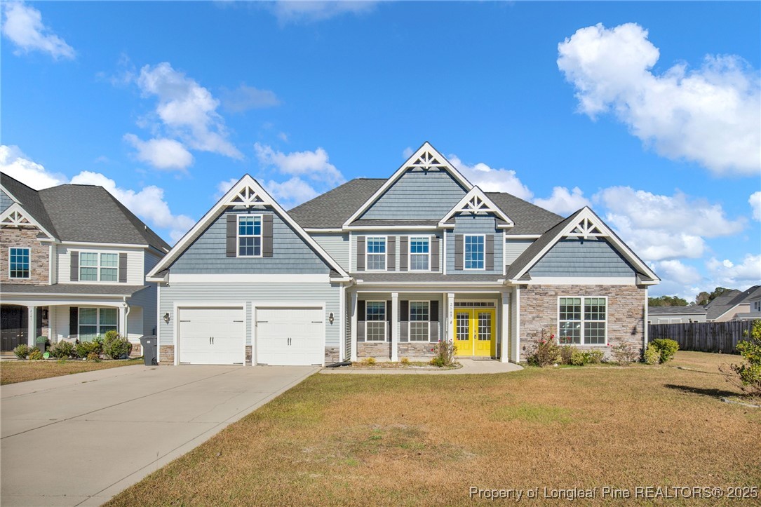 2145 Harrington Road Fayetteville, NC 28306 - Photo 2 of 50 front view of a house with a yard