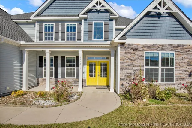 a view of entryway with wooden floor and stairs