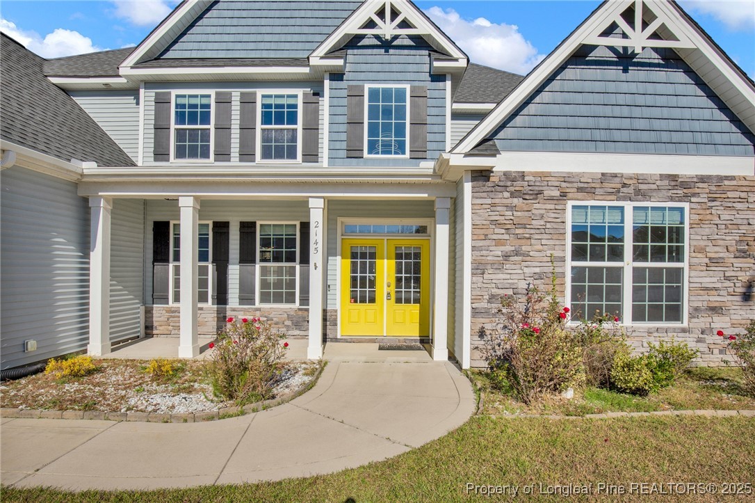 2145 Harrington Road Fayetteville, NC 28306 - Photo 3 of 50 front view of a brick house with a small yard