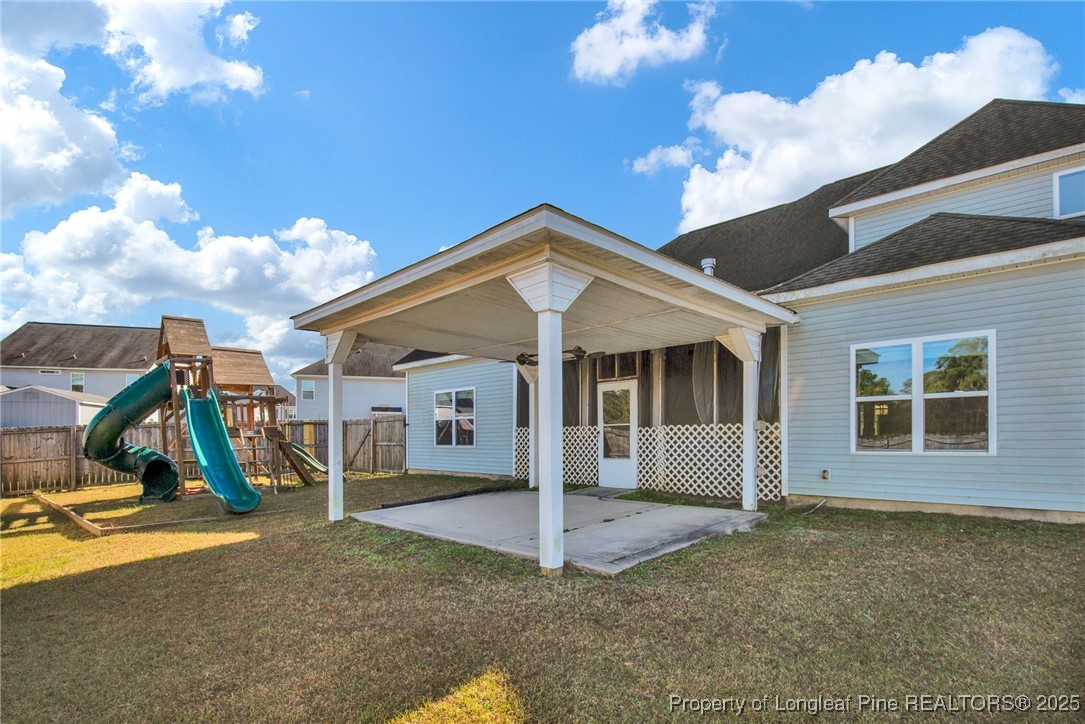 2145 Harrington Road Fayetteville, NC 28306 - Photo 49 of 50 a view of a house with a backyard