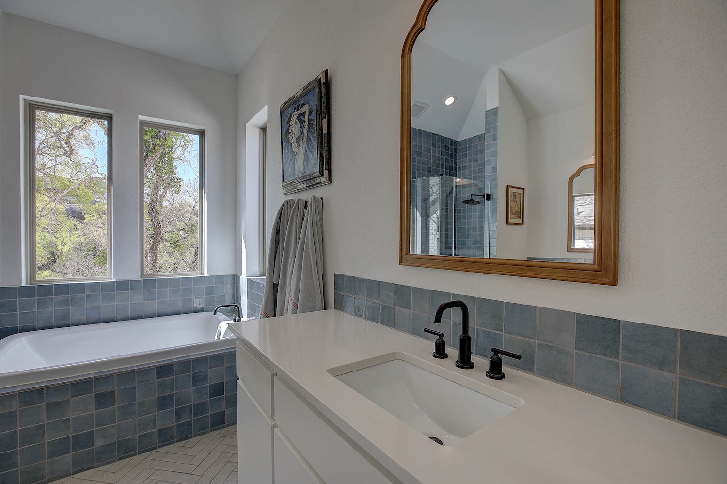 129 Hollytree Court Georgetown, TX 78628 - Photo 31 of 40 Spa like primary bathroom is cool and relaxing. Whether you shower or bathe, serenity lives here! Dual vanities for ease when readying for the day.