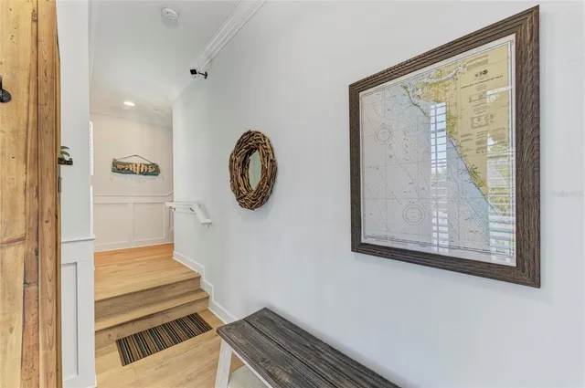 a large white kitchen with a large window cabinets and stainless steel appliances