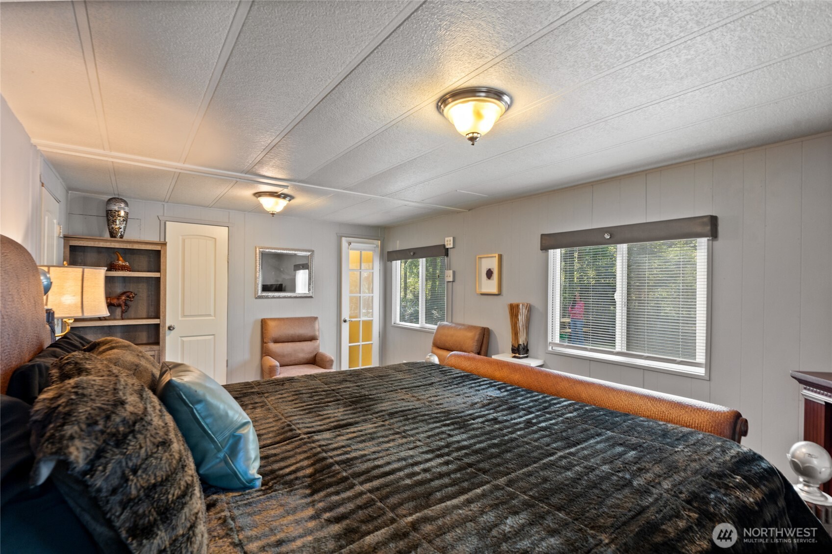 271 Skate Creek Road North Ashford, WA 98304 - Photo 13 of 40 a bedroom with a bed and wooden floor