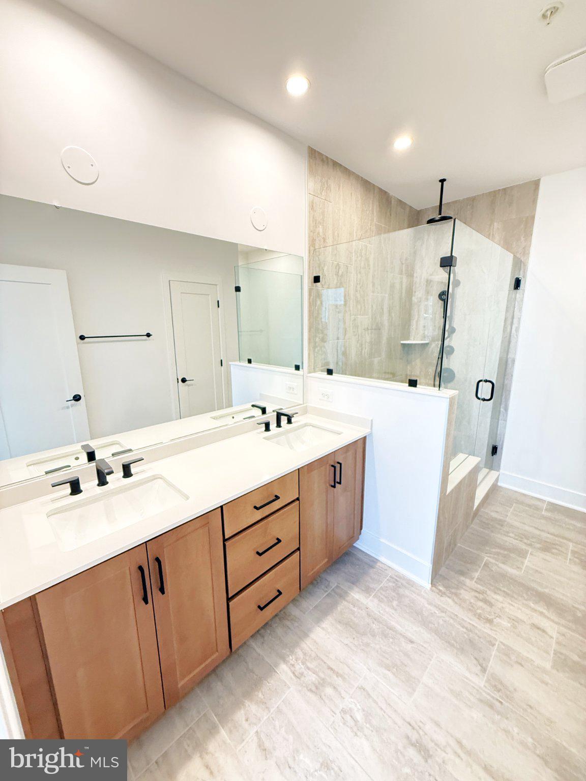 33 Lower Service Court Northwest Washington, DC 20001 - Photo 33 of 51 Sleek modern bathroom with glass shower.