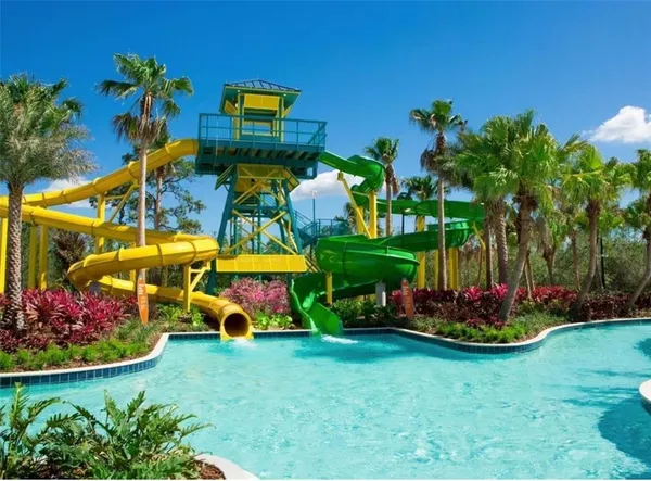 a childrens park with lots of swings and slides