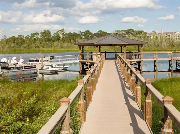 a view of swimming pool with a table and chairs