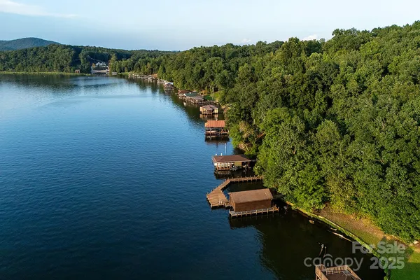 an aerial view of a house with a lake view