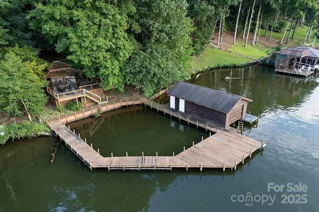 an aerial view of house with yard swimming pool and outdoor seating