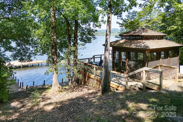 a view of a patio with table and chairs under an umbrella