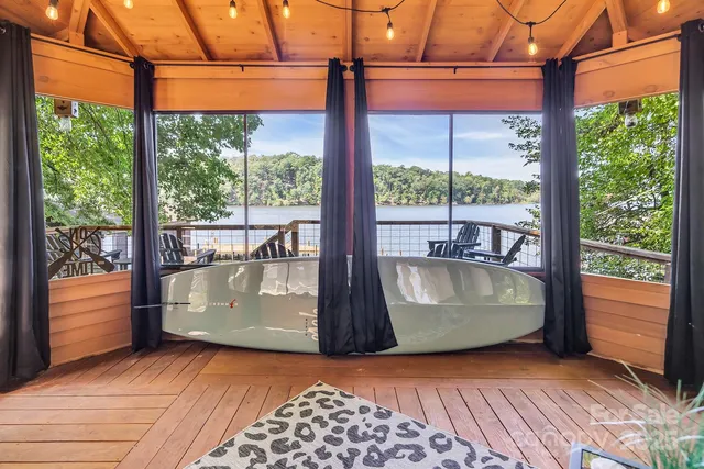 a view of wooden floor with a large window