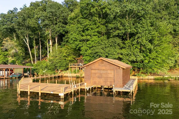 a view of a lake with a bench and table