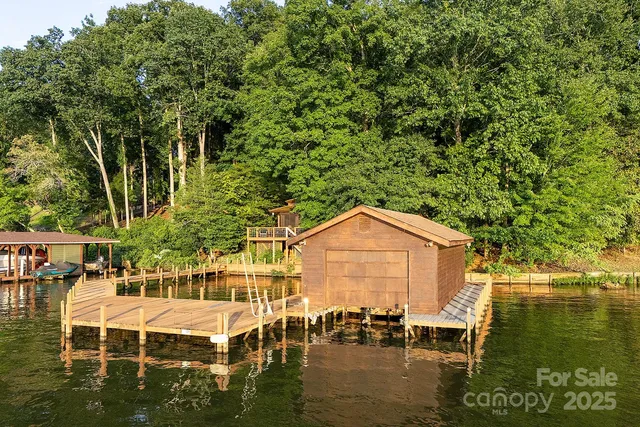 a view of a lake with a bench and table