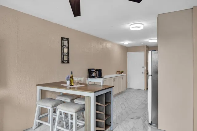 a dining room with a table and chairs