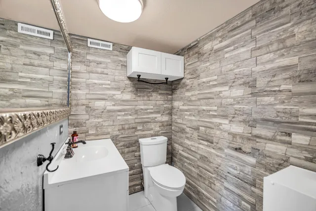 a bathroom with a toilet and a sink