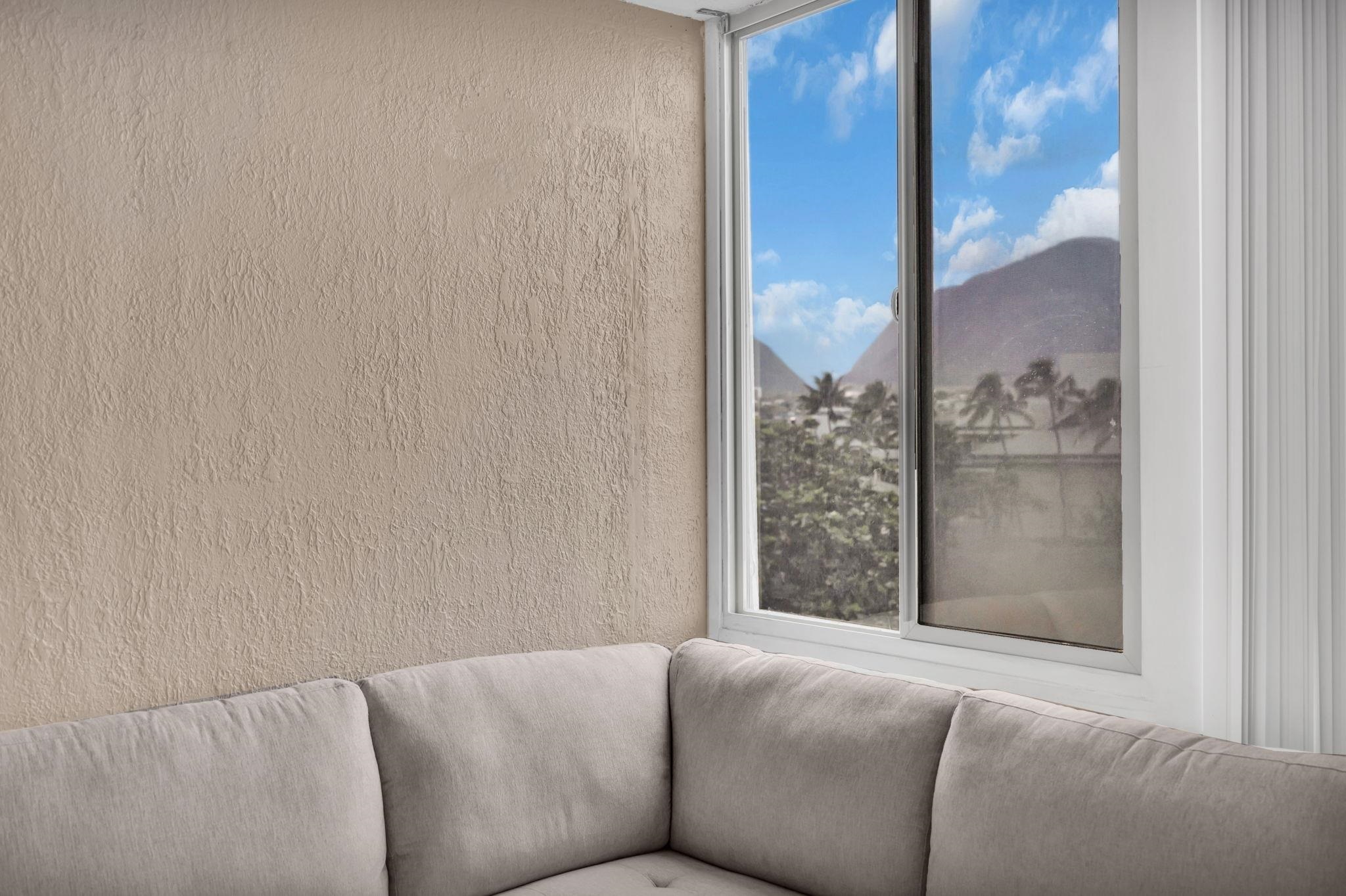 111 Kahului Beach Road, Unit D402 Kahului, HI 96732 - Photo 9 of 35 a living room with a couch and a table