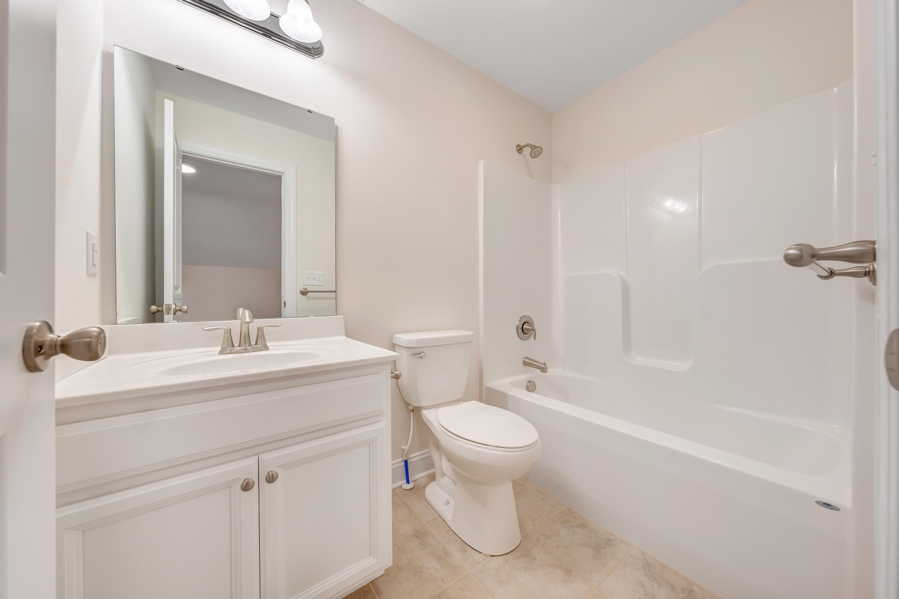 3086 Isabel Lane Salem, VA 24153 - Photo 21 of 24 a bathroom with a sink toilet vanity and shower