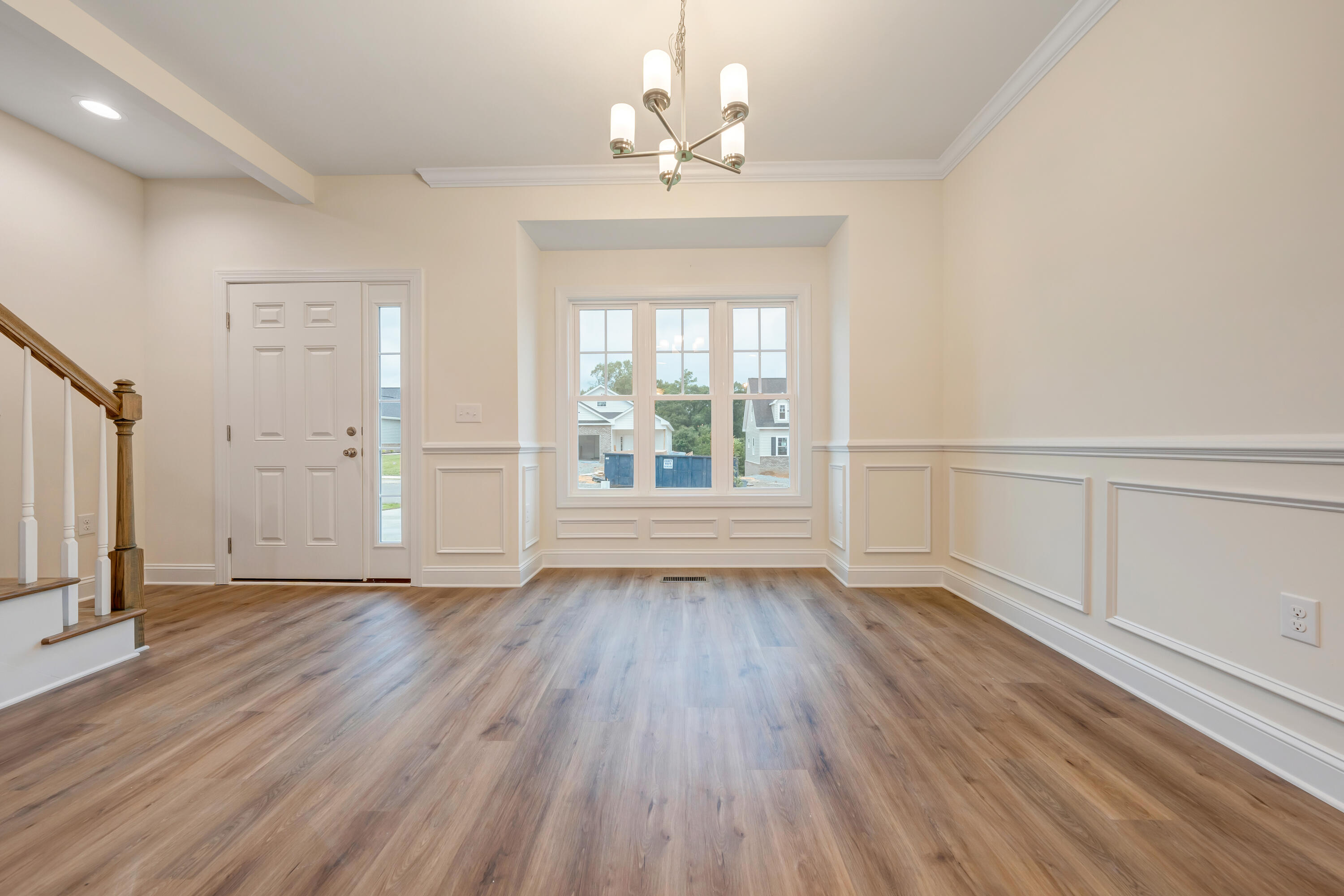 3086 Isabel Lane Salem, VA 24153 - Photo 6 of 24 an empty room with wooden floor chandelier and windows