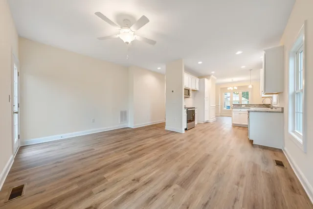 a view of kitchen with wooden floor and window