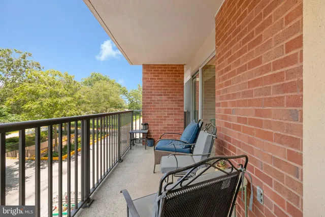 a view of a balcony with chairs