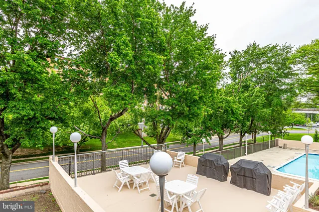 a view of backyard with a table and chairs