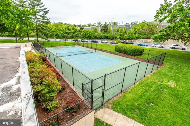 a view of a backyard with floor to ceiling window