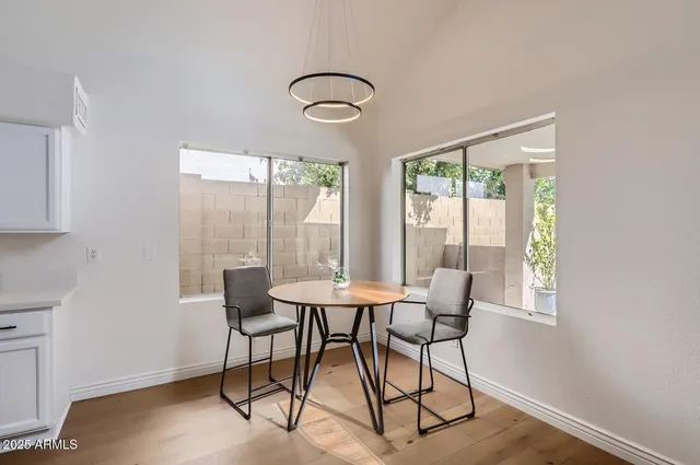 a dining room with furniture and window
