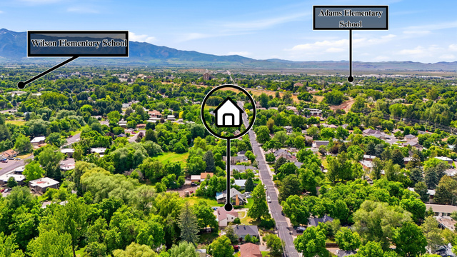 778 East 200 North Logan, UT 84321 - Photo 37 of 43 Aerial perspective showcasing a residential area with extensive tree canopy and distant mountain ranges