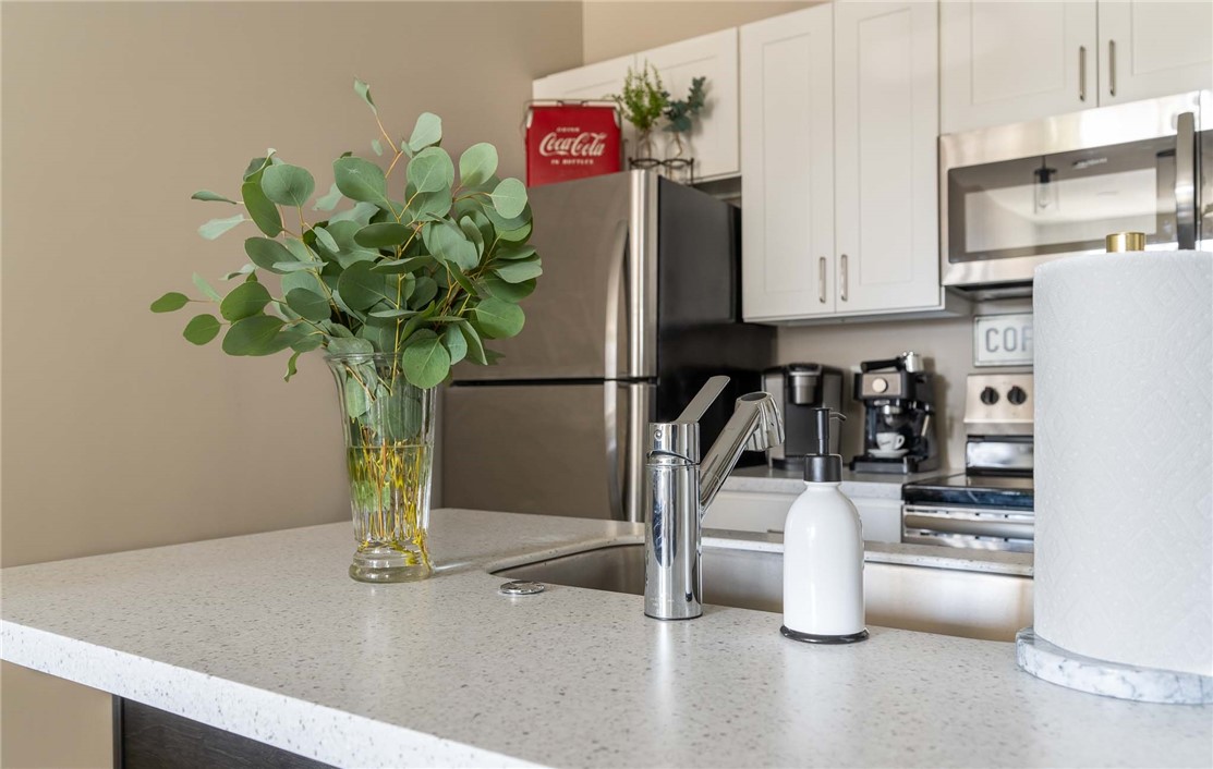 625 South Goodman Street, Unit 309 Rochester, NY 14620 - Photo 3 of 14 Typical kitchen with breakfast bar and stainless s