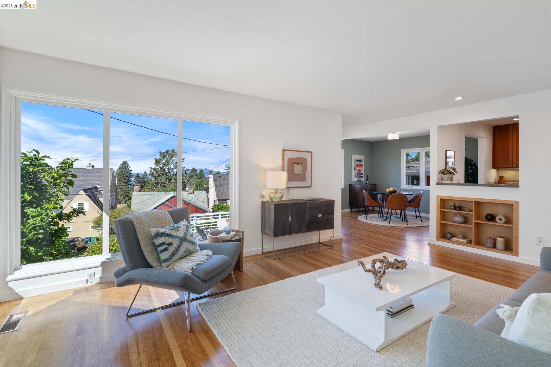 49 Windsor Avenue Kensington, CA 94708 - Photo 11 of 60 a living room with furniture and a large window