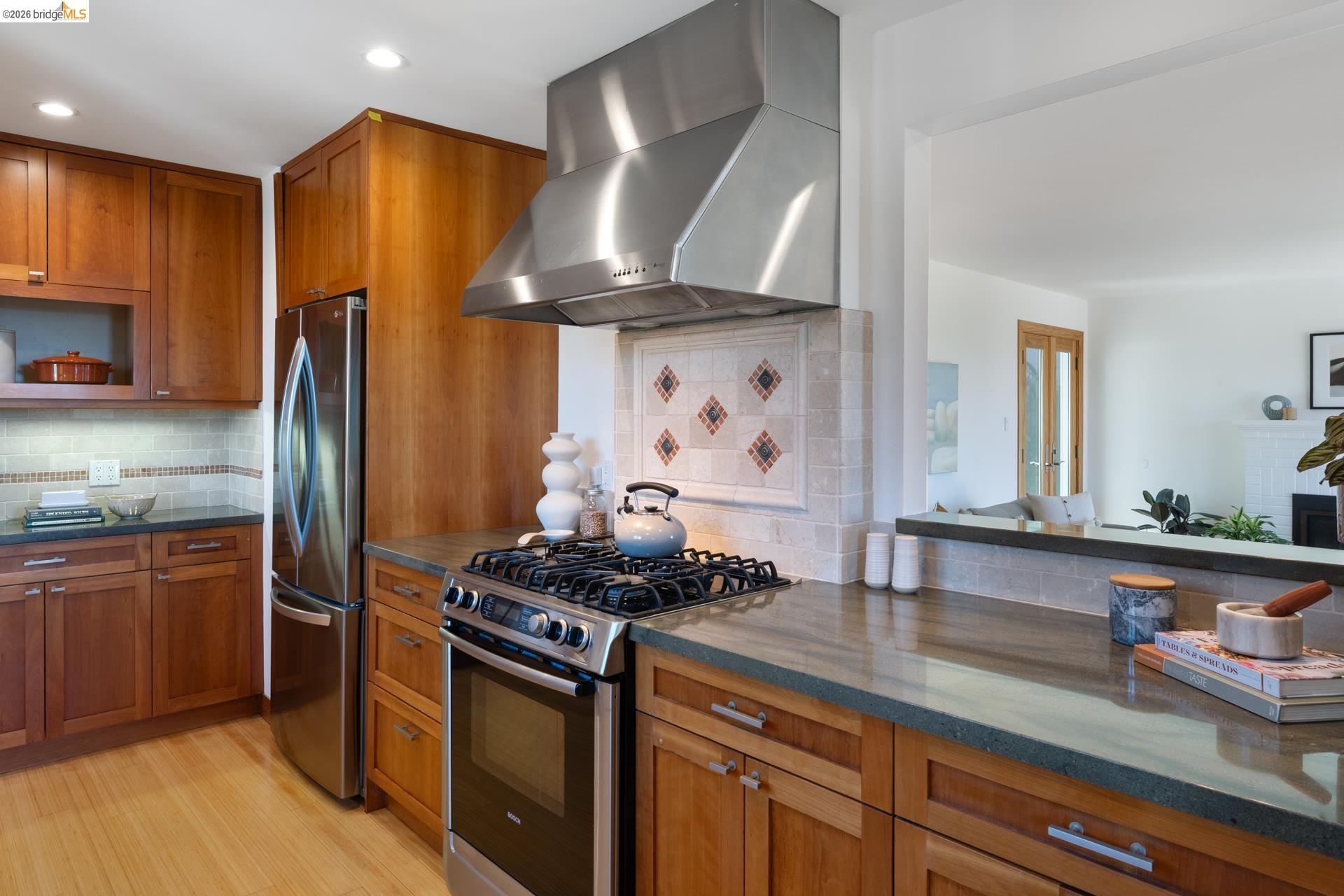 49 Windsor Avenue Kensington, CA 94708 - Photo 18 of 60 a kitchen with stainless steel appliances granite countertop a sink stove and refrigerator