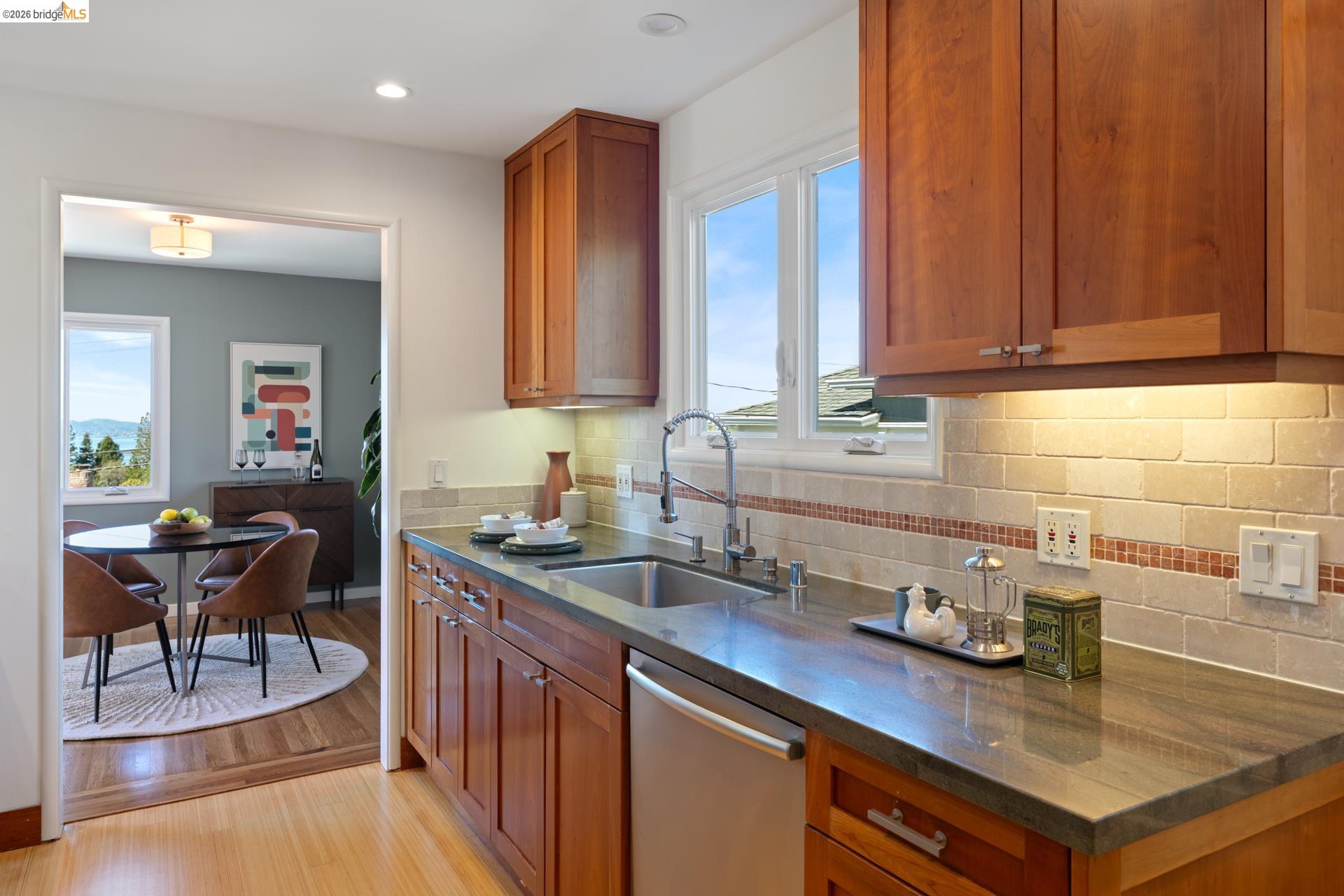 49 Windsor Avenue Kensington, CA 94708 - Photo 19 of 60 a kitchen with a sink cabinets and wooden floor