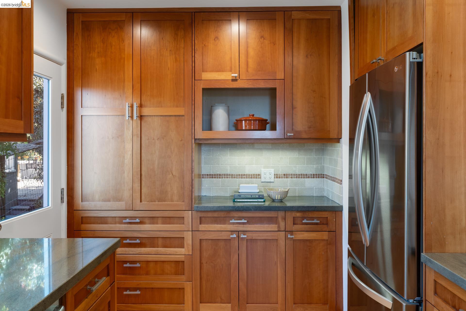 49 Windsor Avenue Kensington, CA 94708 - Photo 21 of 60 a kitchen with stainless steel appliances granite countertop a refrigerator and a sink