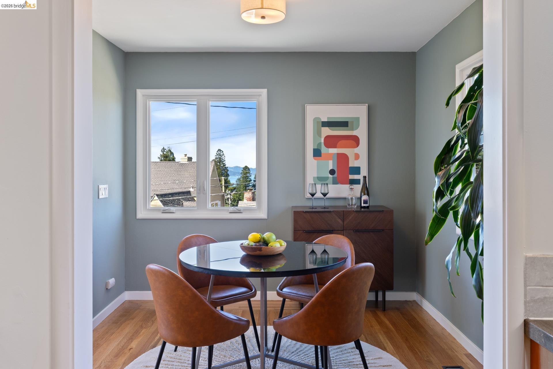 49 Windsor Avenue Kensington, CA 94708 - Photo 23 of 60 a view of a dining room with furniture window and wooden floor