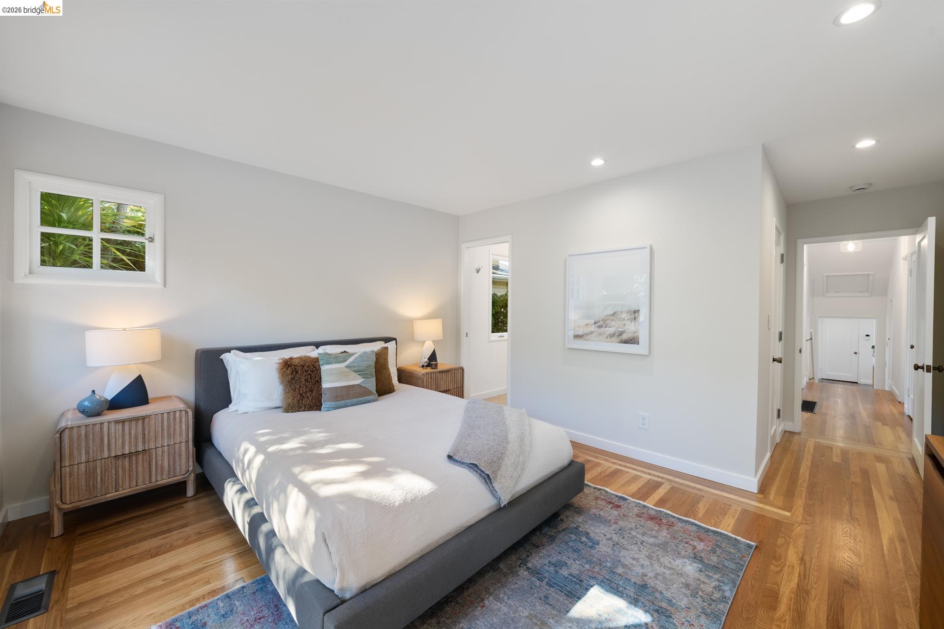 49 Windsor Avenue Kensington, CA 94708 - Photo 27 of 60 a bedroom with a bed and wooden floor