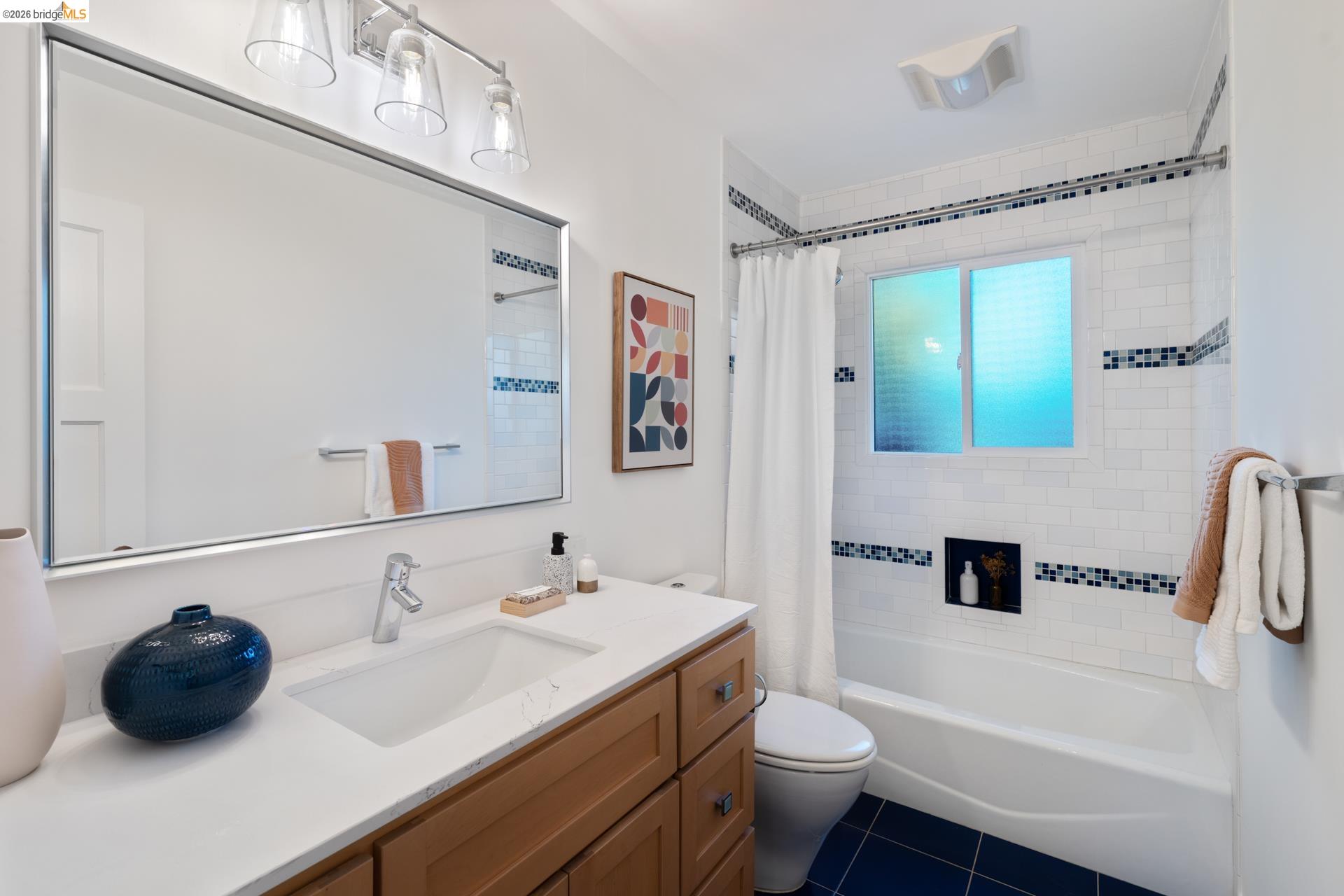 49 Windsor Avenue Kensington, CA 94708 - Photo 35 of 60 a bathroom with a sink a toilet and a mirror