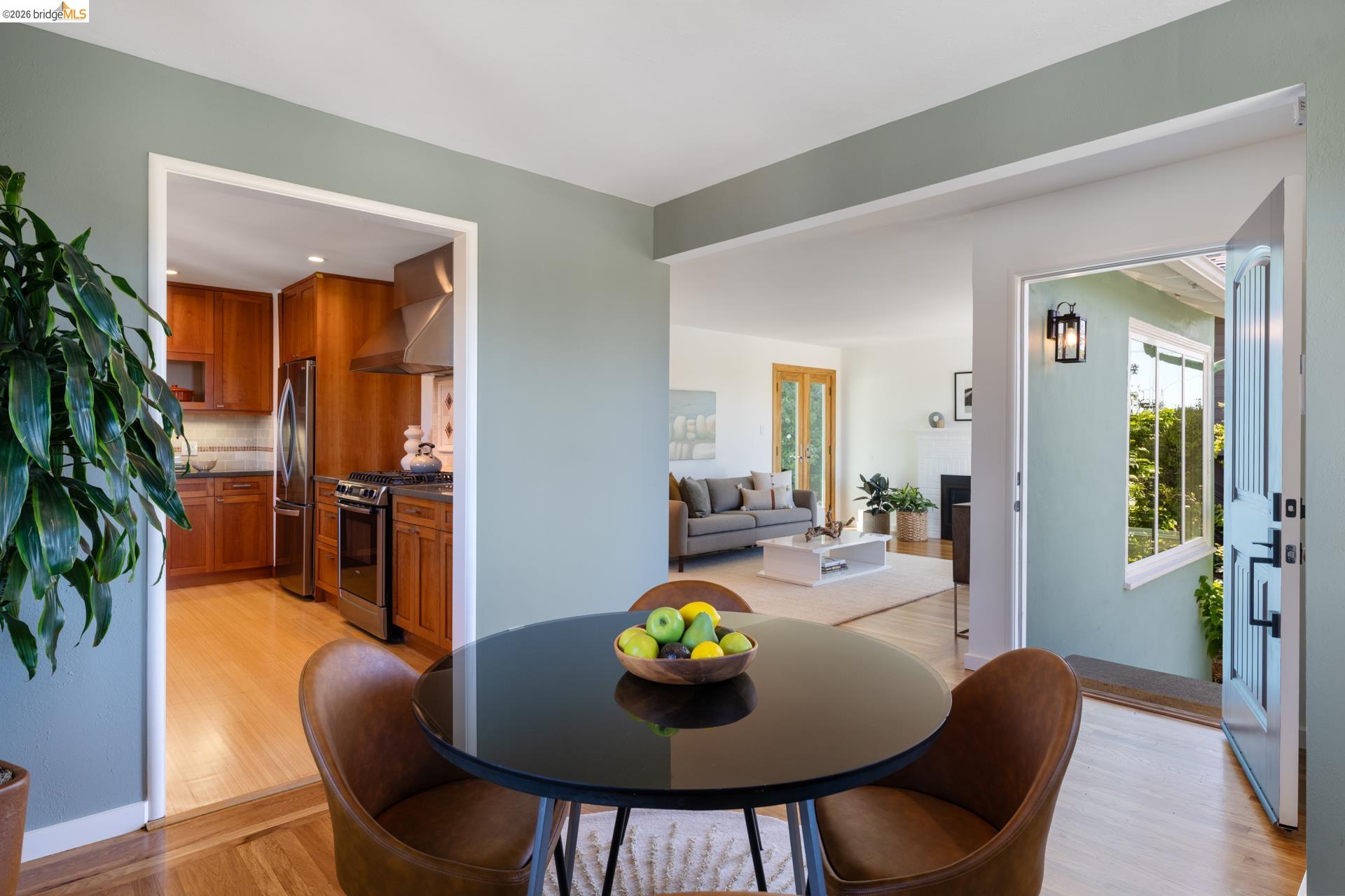 49 Windsor Avenue Kensington, CA 94708 - Photo 6 of 60 a view of a dining room with furniture and a potted plant
