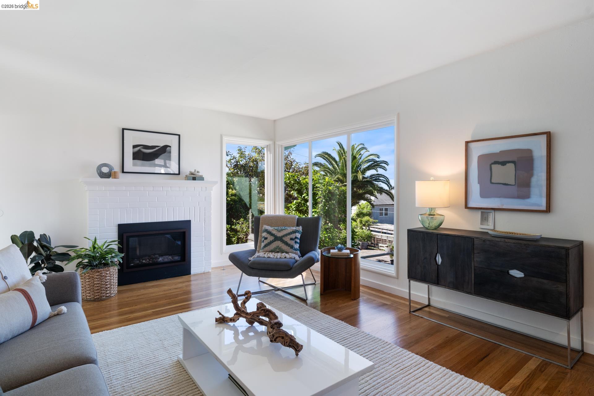 49 Windsor Avenue Kensington, CA 94708 - Photo 9 of 60 a living room with furniture a fireplace and a potted plant