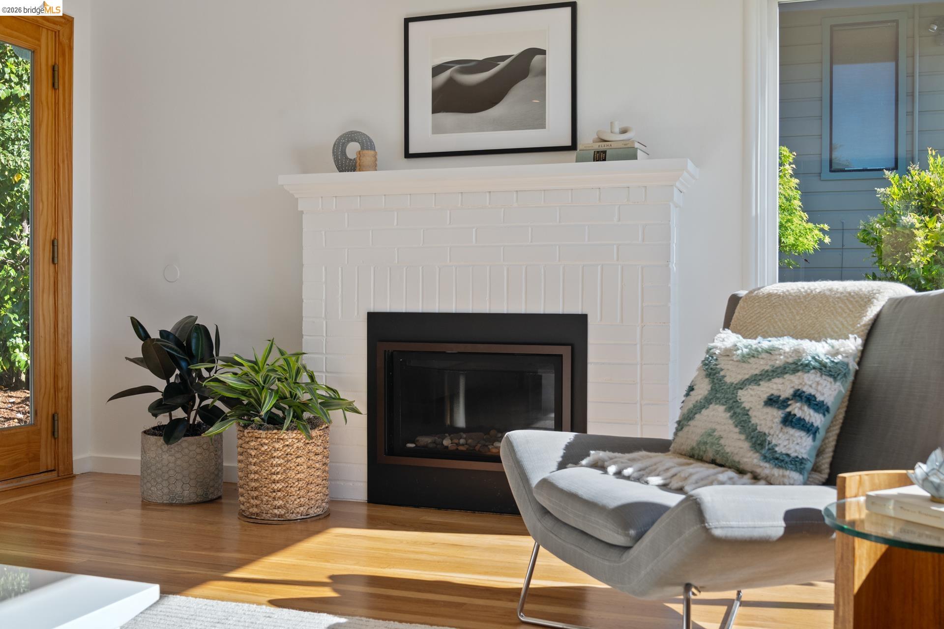 49 Windsor Avenue Kensington, CA 94708 - Photo 10 of 60 a living room with furniture potted plant and a fireplace