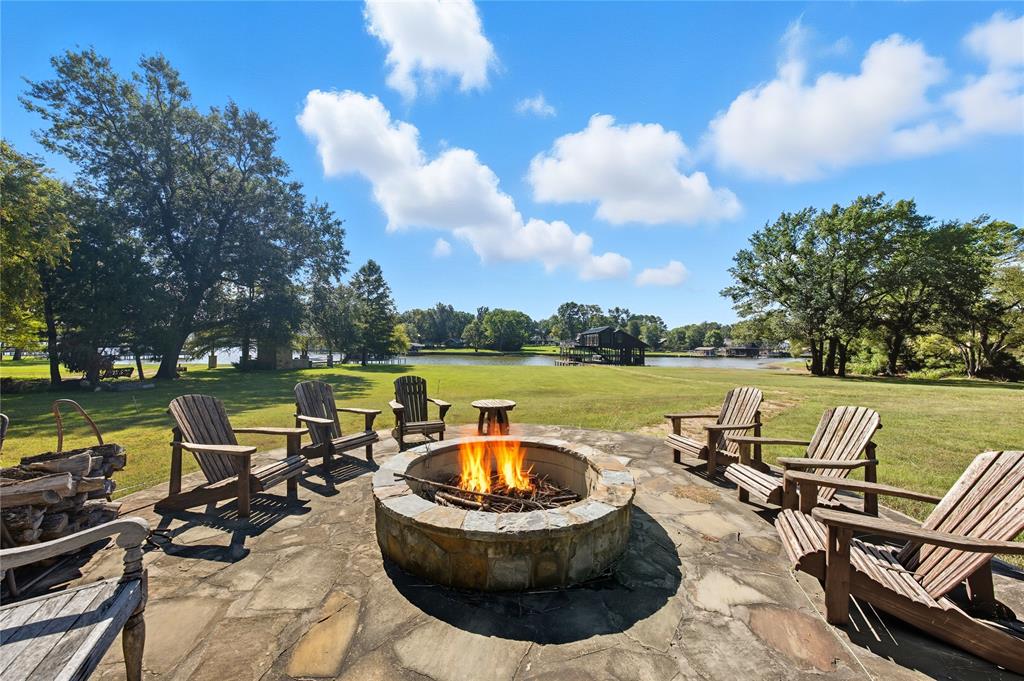 a view of a lake with couches and city view