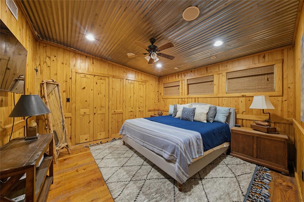 100 Letha Road Trinidad, TX 75163 - Photo 13 of 38 a bedroom with a bed and a chandelier