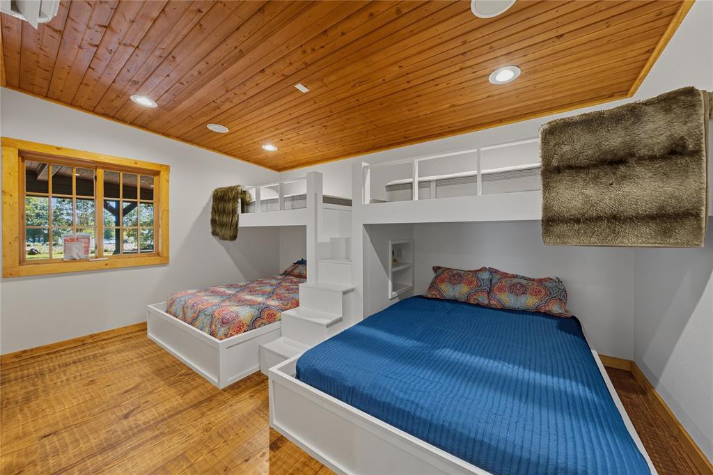 100 Letha Road Trinidad, TX 75163 - Photo 14 of 38 a bedroom with furniture and a wooden floor